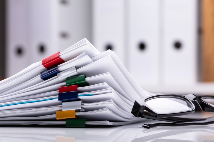 Stacked Method Statement Documents and glasses